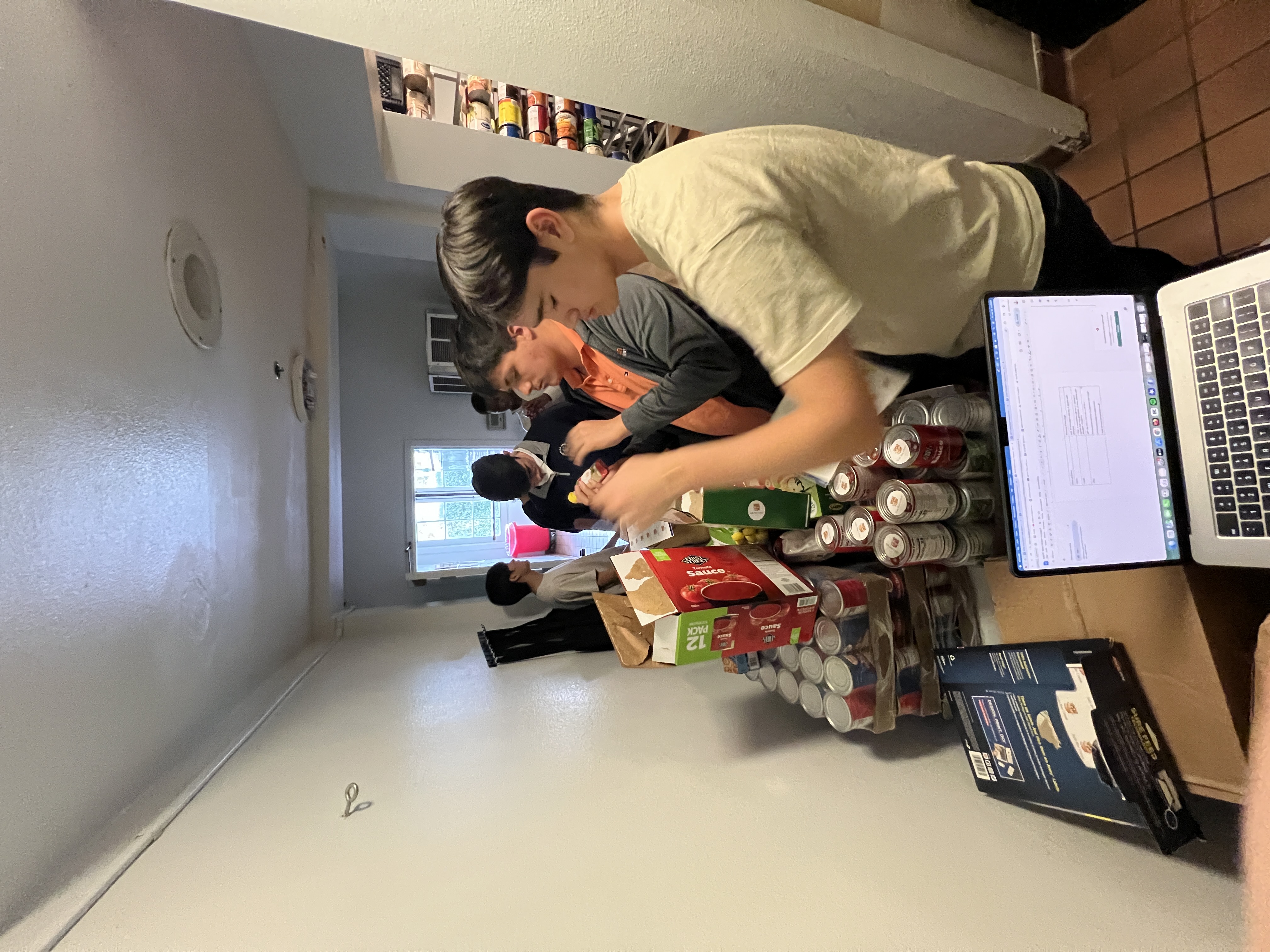 Carrying food boxes into the pantry