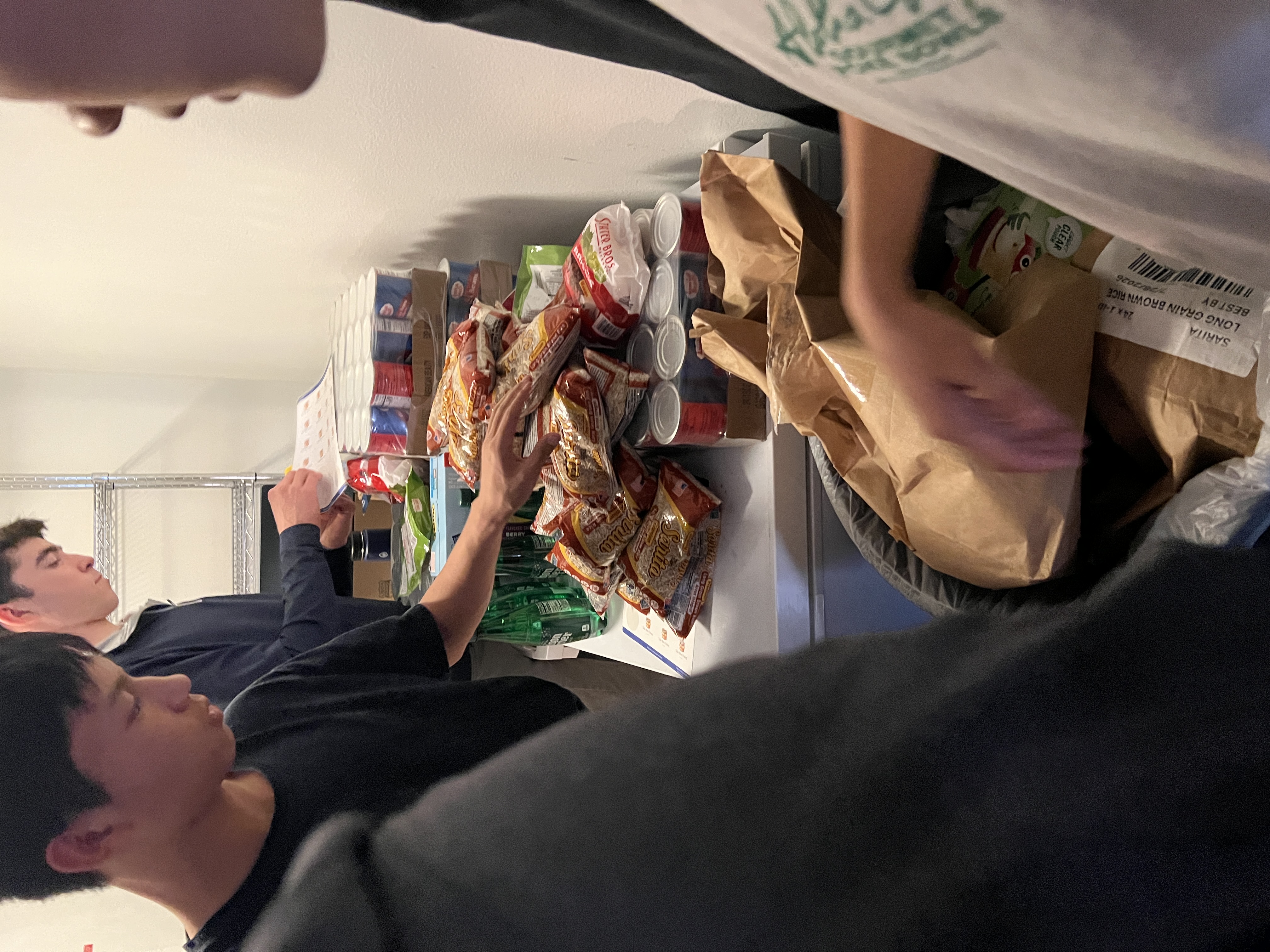 Volunteers sorting food items for distribution