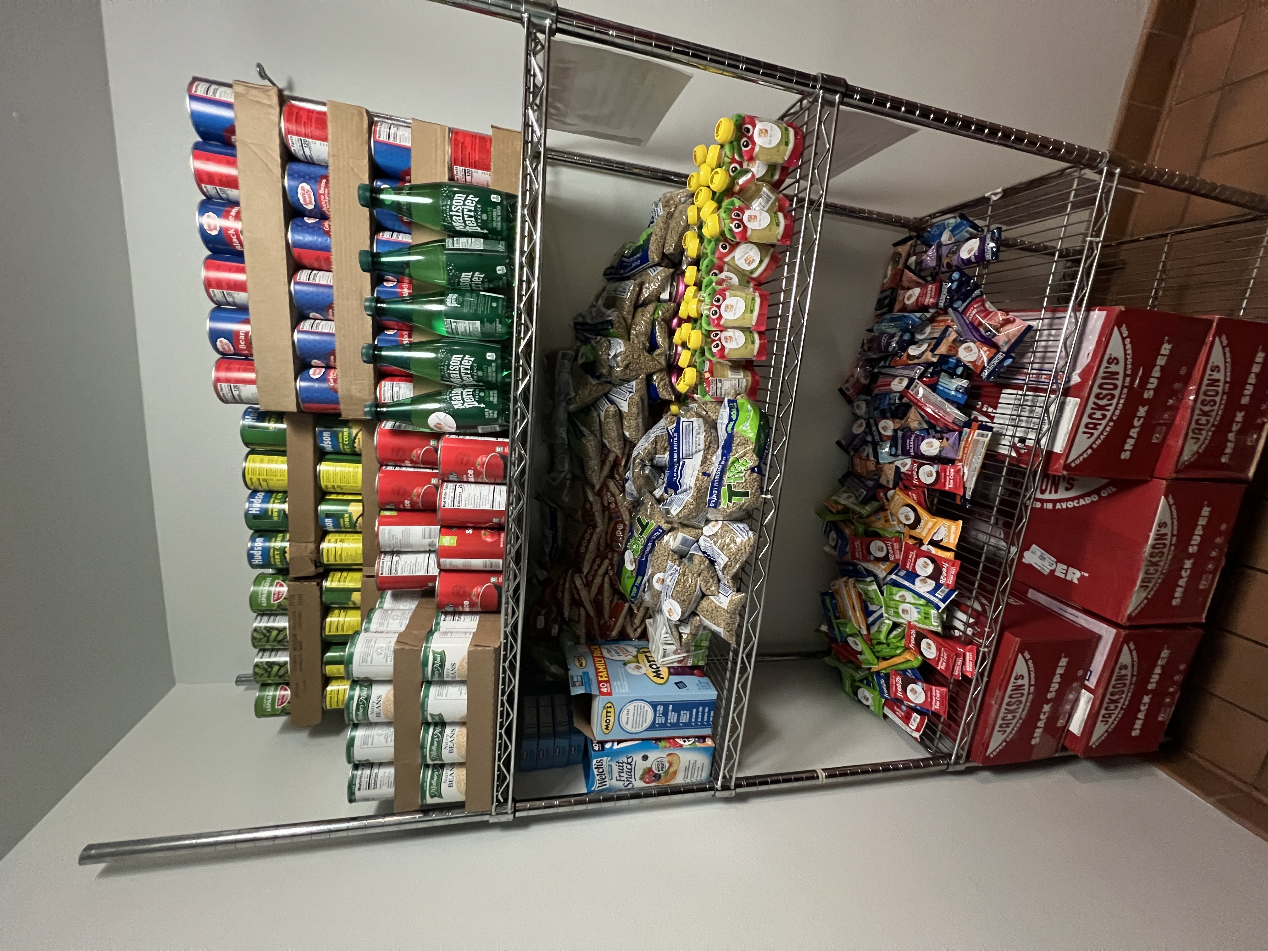 Fully stocked pantry shelves with allergen-free food